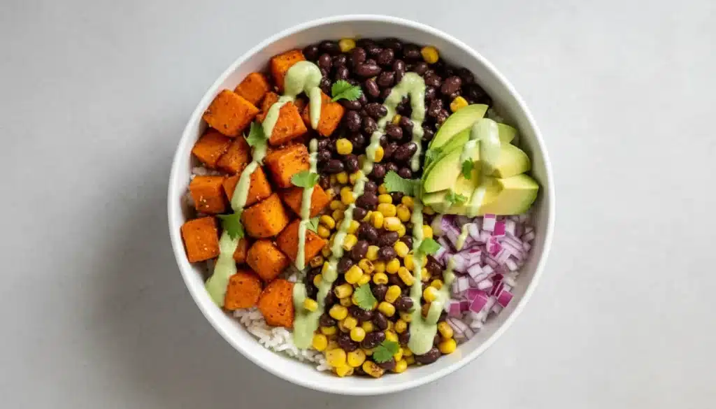 Colorful Sweet Potato Taco Bowl with rice, black beans, and avocado