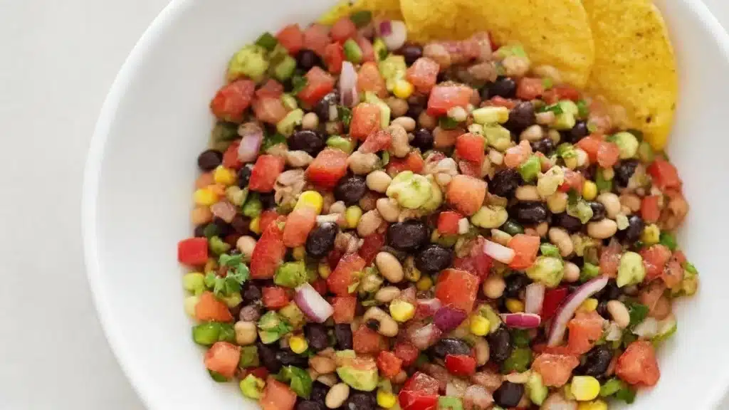 Colorful Cowboy Caviar with beans, corn, peppers, and lime dressing